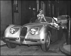 My parents and the silver Jaguar they were about to sell because my mother was pregnant with me and they needed the money