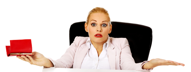Worried business woman sitting behind the desk with empty wallet
