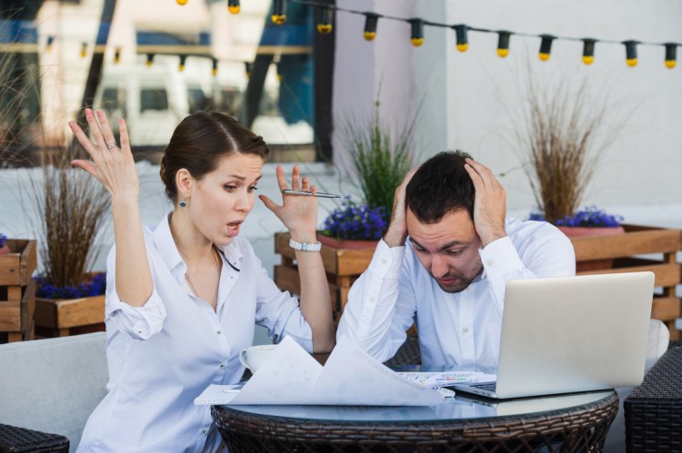 business people conflict working problem, angry boss argue scream to colleague businessmen and women serious argument negative emotion discussing report meeting at outdoors cafe during the lunch.